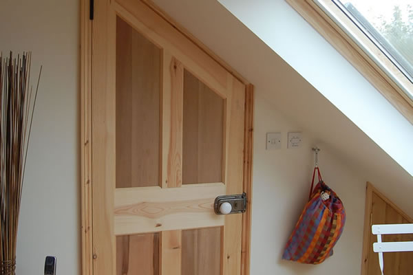 Internal door angled to match sloping ceiling